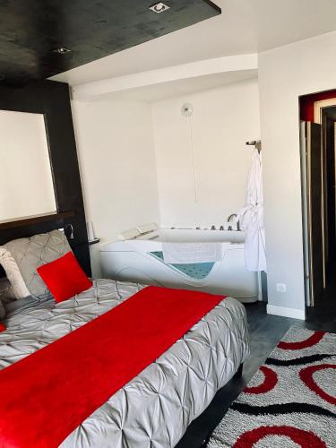 a bedroom with a bed and a bath tub at ADsweet in Épernay