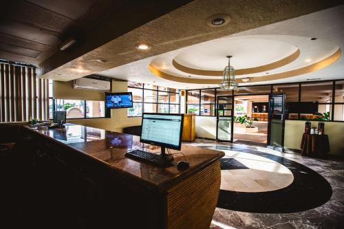 an office with a desk with a computer on it at Del Mar Inn Rosarito in Rosarito