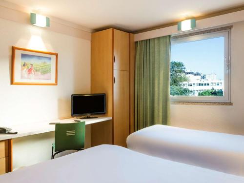 Postel nebo postele na pokoji v ubytování Hotel ibis Porto Sao Joao