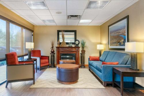 a living room with a couch and a table at Comfort Inn Chattanooga Downtown Southside in Chattanooga