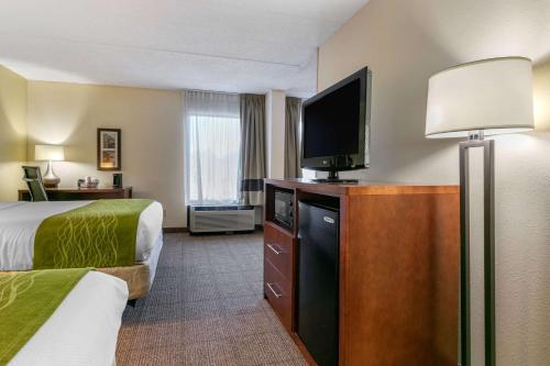 a hotel room with two beds and a flat screen tv at Comfort Inn Chattanooga Downtown Southside in Chattanooga