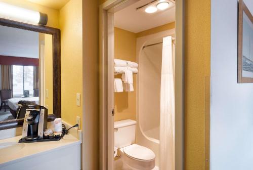 a bathroom with a toilet and a sink at Quality Inn Easton in Easton