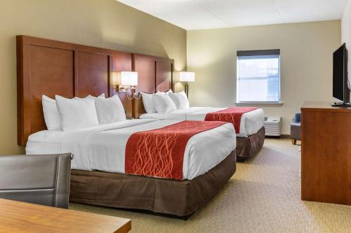 a hotel room with two beds and a television at Comfort Inn Lancaster at Rockvale in Lancaster