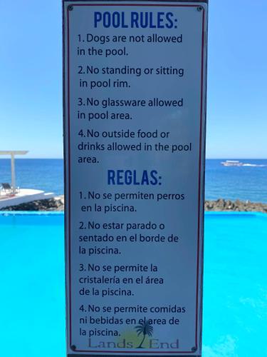 a sign describing the rules for the beach at Lands End in West End