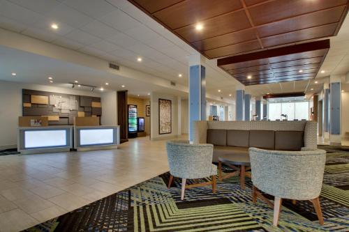 an office lobby with a table and chairs at Holiday Inn Express & Suites Mt Sterling North by IHG in Mount Sterling