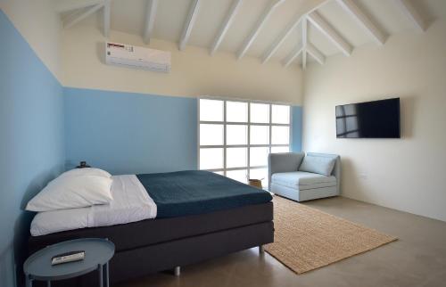 Cama ou camas em um quarto em Koeriboeri Aruba Lodges