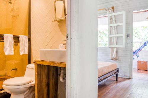 a bathroom with a sink and a toilet at Selina Puerto Viejo in Puerto Viejo