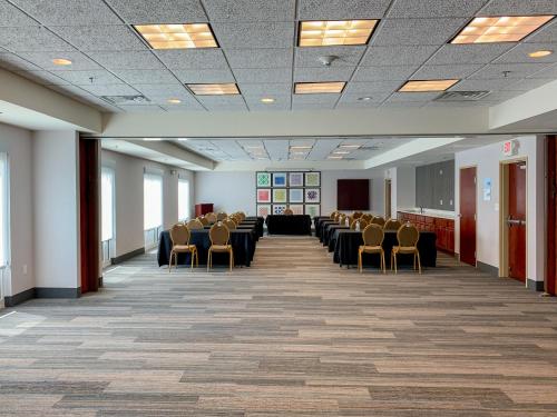 a large room with chairs and tables in it at Holiday Inn Express & Suites Lexington Downtown Area-Keeneland by IHG in Lexington