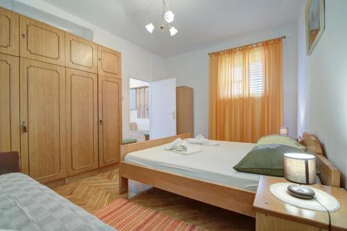 Ένα ή περισσότερα κρεβάτια σε δωμάτιο στο Apartment Riva