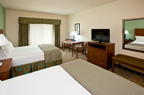 a hotel room with two beds and a television at Holiday Inn Express & Suites Ripley by IHG in Ripley