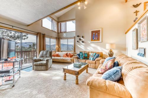 a living room with a couch and a table at Lift A4 Condo in Angel Fire