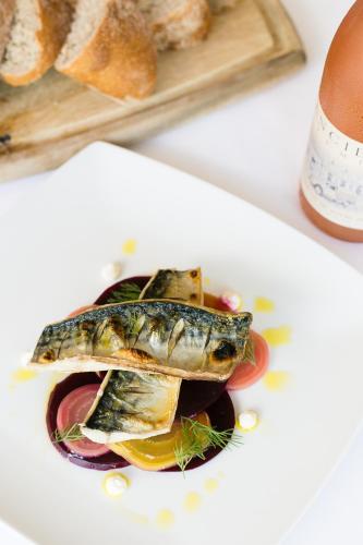 a plate of food with a fish on it at The Maltsters Arms in Totnes