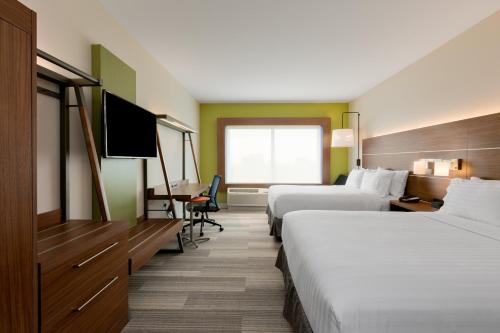 a hotel room with two beds and a flat screen tv at Holiday Inn Express & Suites - Prosser - Yakima Valley Wine by IHG in Prosser