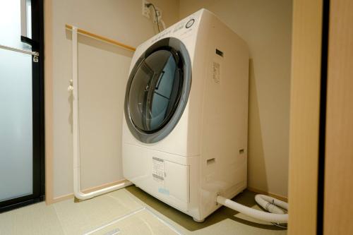 a hospital room with a washing machine in it at so, KANAZAWA in Kanazawa