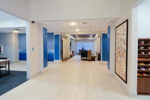 a hallway in a office building with blue walls at Holiday Inn Express Rolla, an IHG Hotel in Rolla