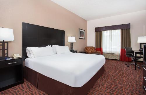 a large white bed in a hotel room at Holiday Inn Express & Suites Murphy by IHG in Murphy