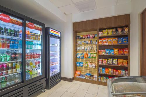 a store with two refrigerators in a grocery store at Holiday Inn Express Hotel & Suites Tampa-USF-Busch Gardens by IHG in Tampa