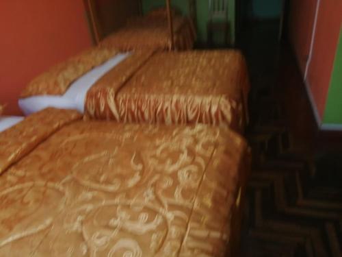 Cama o camas de una habitación en Hospedaje El Arca
