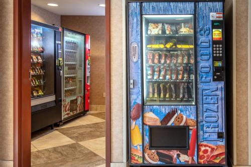 a refrigerator filled with lots of drinks and bread at Holiday Inn Express Hotel & Suites Richland in Richland