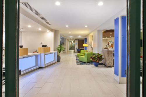 a lobby of a hospital with a waiting room at Holiday Inn Express Rochester-Victor by IHG in Victor