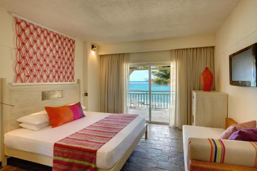 Postel nebo postele na pokoji v ubytování Solana Beach Mauritius - Adults Only