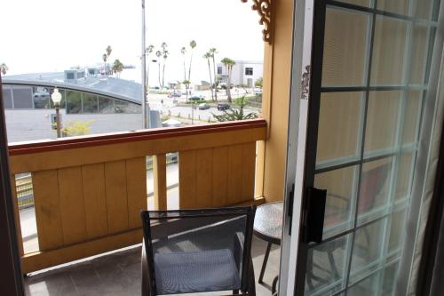 a balcony with a chair and a view of a street at Howard Johnson by Wyndham Santa Cruz in Santa Cruz