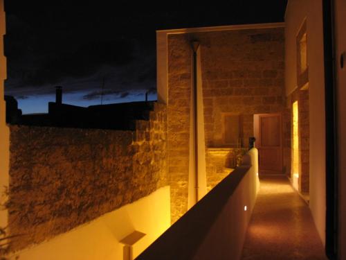 a view of a hallway at night at Corte Dei Nonni in Presicce