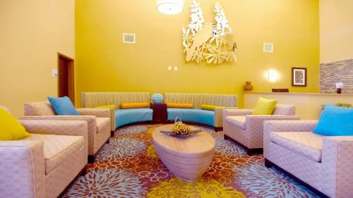 a waiting room with couches and a table at Holiday Inn Express Hotels & Suites Cuero by IHG in Cuero