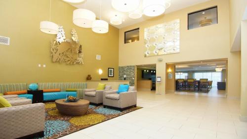 a lobby with couches and chairs in a hospital at Holiday Inn Express Hotels & Suites Cuero, an IHG Hotel in Cuero