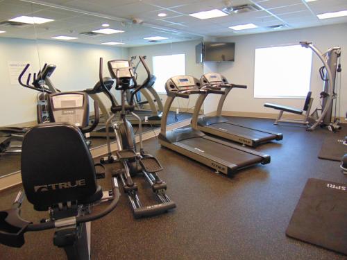 a gym with several cardio bikes and tread machines at Holiday Inn Express & Suites Springville-South Provo Area by IHG in Springville