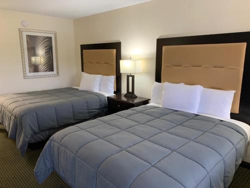 a hotel room with two beds in a room at Blackwater Inn Milton in Milton