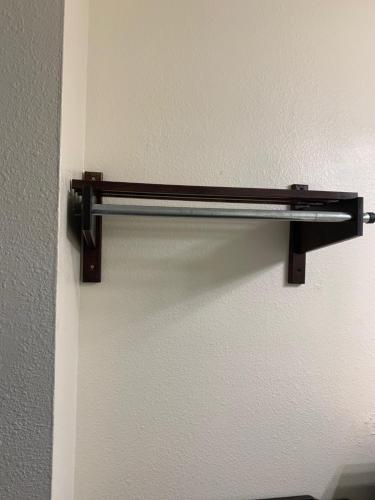 a metal towel rack hanging on a wall at Blackwater Inn Milton in Milton