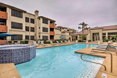 a swimming pool at a apartment complex with chairs at Modern Condo with Pool Access about 3 Mi to Dtwn Phoenix in Phoenix