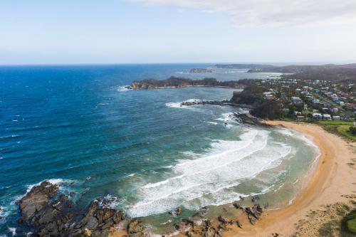 an aerial view of a beach and the ocean at Abode Malua Bay in Malua Bay