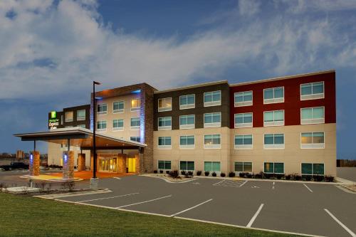 a building with a parking lot in front of it at Holiday Inn Express & Suites Mt Sterling North by IHG in Mount Sterling