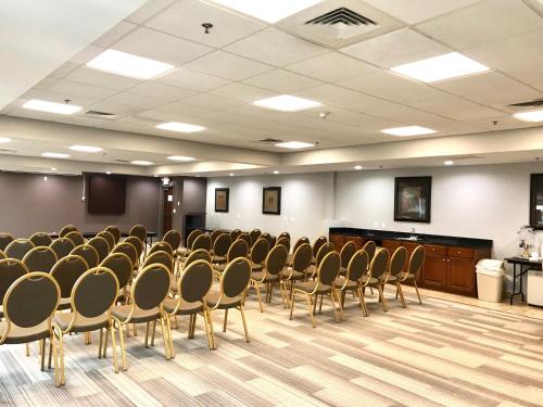 a conference room with chairs and a podium in it at Holiday Inn Express Hotel & Suites Somerset Central by IHG in Somerset