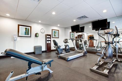 a gym with several treadmills and cardio machines at Holiday Inn Express & Suites Raceland - Highway 90 by IHG in Raceland