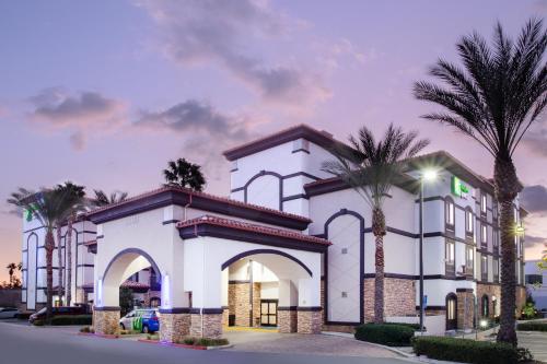 a rendering of a hotel with palm trees at Holiday Inn Express Ontario by IHG in Creekside