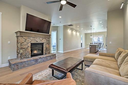 a living room with a fireplace and a tv at Flagstaff Oasis with Hot Tub - 3 Mi to Downtown! in Flagstaff