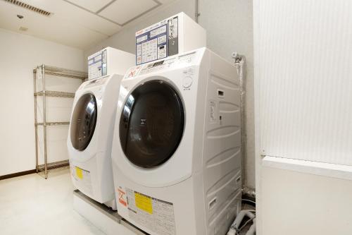 a washer and dryer in a laundry room at Gifu Washington Hotel Plaza in Gifu