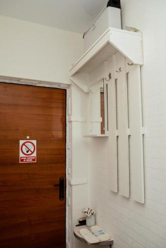 a room with a door and a sign on a wall at Apartments at Kontorska 10 in Kharkiv