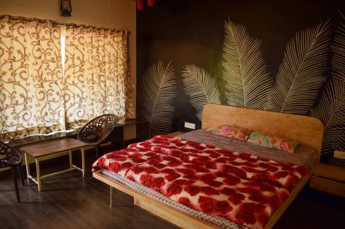 מיטה או מיטות בחדר ב-Jungle Valley Agriculture Resort