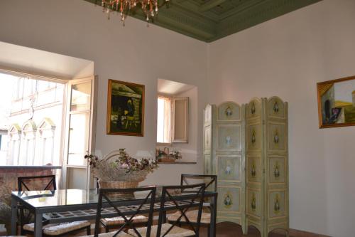 a living room with a table and a cabinet at Clockwise in Viterbo