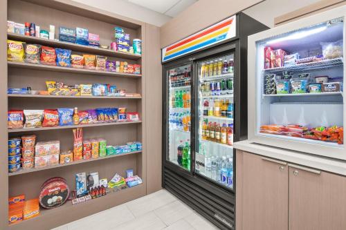 a grocery store aisle with two refrigerators at Holiday Inn Express Hotels & Suites Greenville-Spartanburg/Duncan by IHG in Duncan