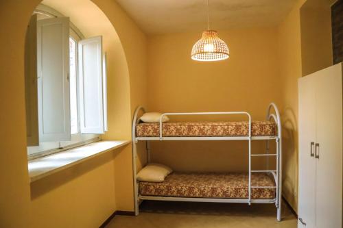 Poschodová posteľ alebo postele v izbe v ubytovaní VillaB&BFrancesca&Gioia