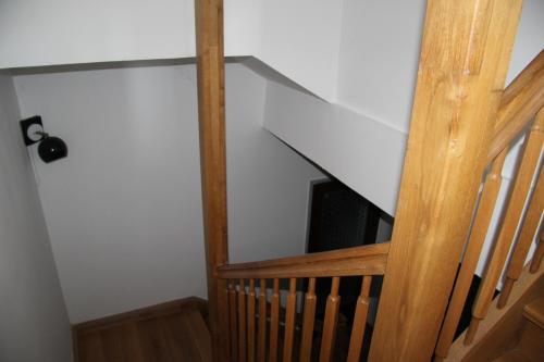 a stairway with a wooden railing and a stair case at Kellerstöckl Eisenberg/Pinka Weiner in Eisenberg an der Pinka