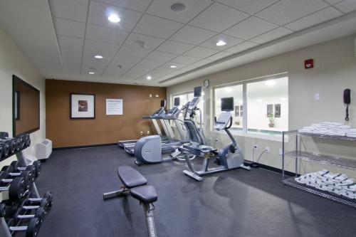 a gym with treadmills and machines in a room at Wingate by Wyndham Fort Saskatchewan in Fort Saskatchewan