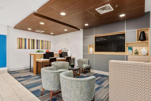 an office with a waiting room with chairs and a desk at Holiday Inn Express West Valley City by IHG in West Valley City