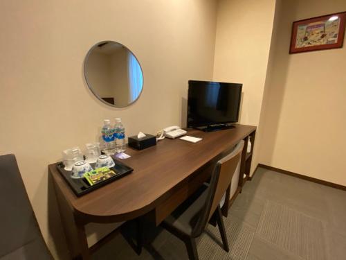 HOTEL SOSHAにあるテレビまたはエンターテインメントセンター