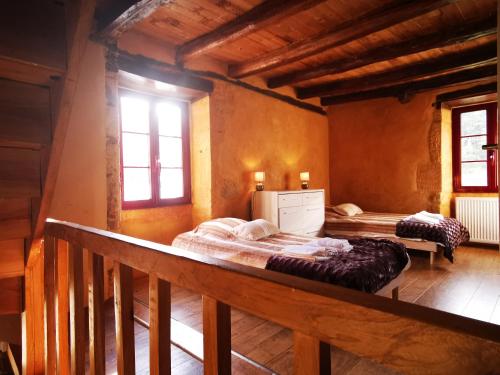 Postel nebo postele na pokoji v ubytování Gîte Les Combes Montignac Lascaux